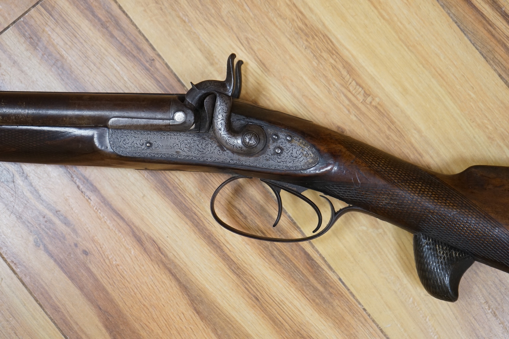 A 1907 bayonet in its scabbard with the tip of the blade shortened, together with a Glengarry cap of the KOSB, post 1902 badge and a brown leather shoulder belt and pouch with QE2 bronze badge of the Royal Artillery